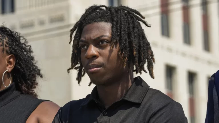 Darryl George stands next to his mother, Darresha George in front of Galveston County Court House on Thursday, May 23, 2024, in Galveston, Texas. A hearing was set to be held Thursday in a federal lawsuit a George filed against his Texas school district over his punishment for refusing to change his hairstyle. (Raquel Natalicchio/Houston Chronicle via AP)