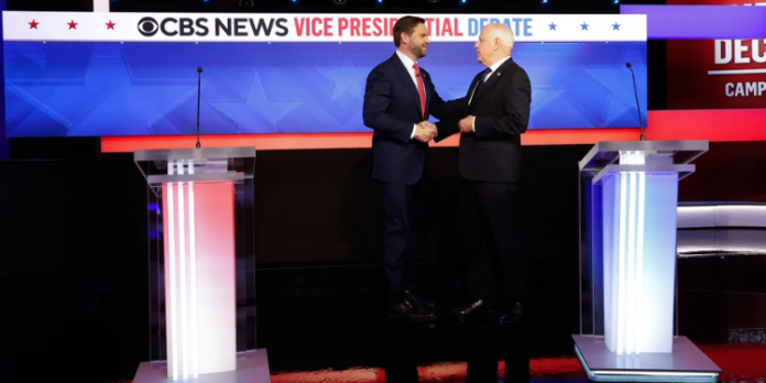 Ohio Sen. JD Vance and Minnesota Gov. Tim Walz greet each other ahead of a debate at the CBS Broadcast Center on October 1, 2024 in New York City. Anna Moneymaker/Getty Images