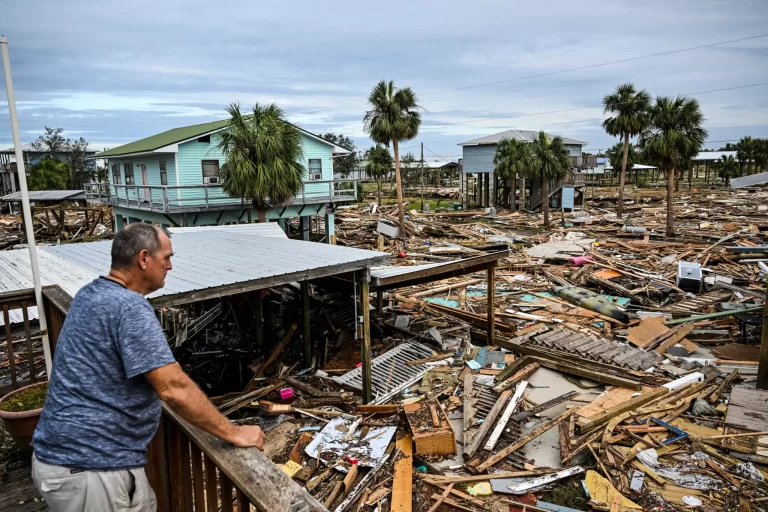 David Hester inspects damages of his house on Saturday after Hurricane Helene made landfall in Horseshoe Beach, Fla. Chandan Khanna/AFP via Getty Images