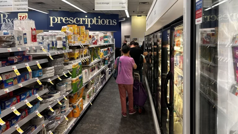 Customers wait to pick up prescriptions at a Walgreens pharmacy in Queens, New York, in July 2024. Lindsey Nicholson/UCG/Universal Images Group/Getty Images