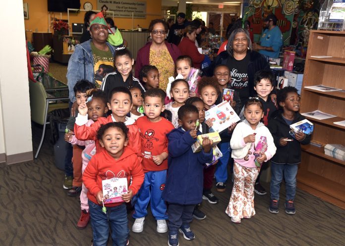 Children of Miller Child Development Center were recipients of toys during the 46th Annual Claude W. Black Community Center Holiday Gift Giveaway. (Photo by Burrell Parmer/CWB)