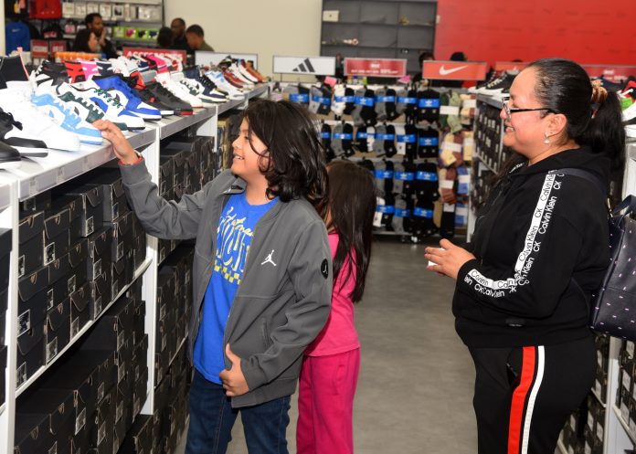 Students, accompanied by their parent(s) or guardian, were provided with a $100 budget to purchase new shoes along with any other item in the store. (Photo by Post 828 Commander Burrell Parmer)