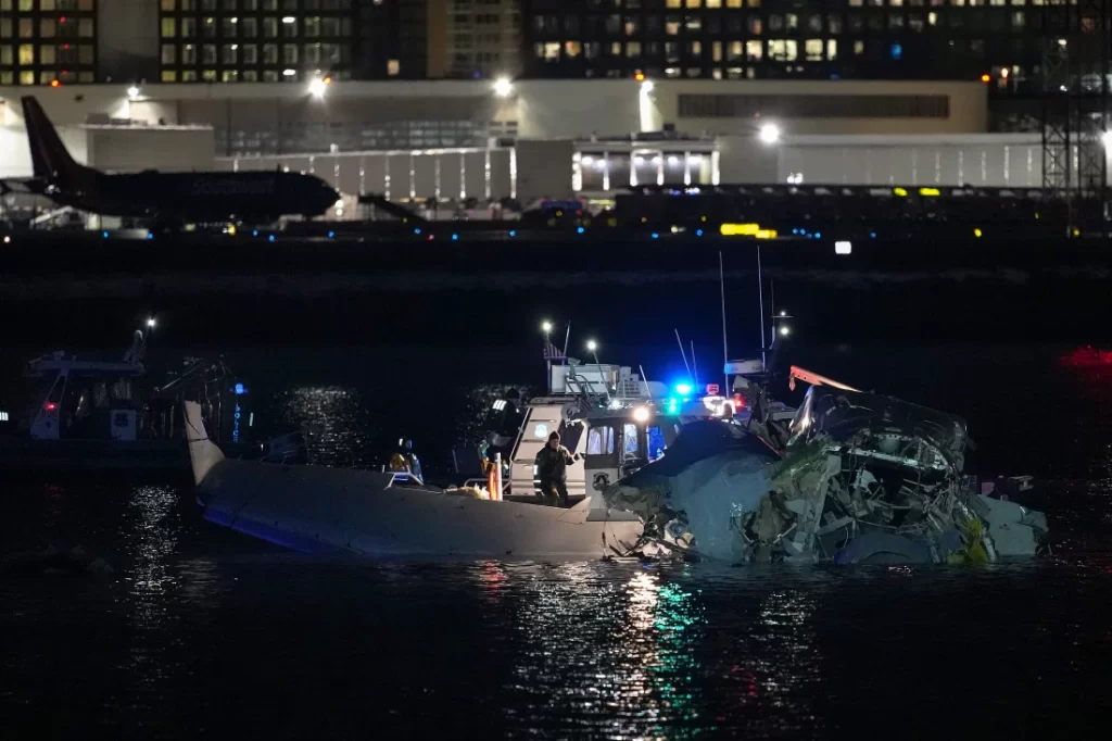 Emergency response units access airplane wreckage in the Potomac River near Ronald Reagan Washington Airport early Thursday in Arlington, Va., after an American Airlines flight from Kansas collided with a helicopter while approaching the airport.

Andrew Harnik/Getty Images