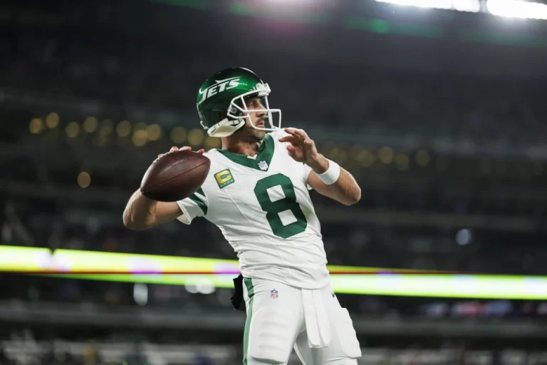 Aaron Rodgers warming up in East Rutherford, N.J., in 2023. Ryan Kang / Getty Images file