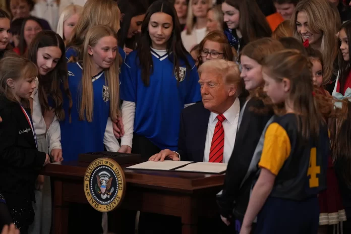 President Trump signed the order on National Girls and Women in Sports Day.Credit...Eric Lee/The New York Times