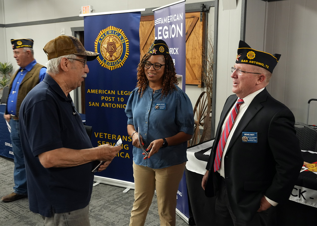 The 20th District Americanism Chairman, Legionnaire Michael Knott of Alamo Post No. 2 and 1st Vice Commander Amanda Parham of Fred Brock Post No. 828 speak with a veteran. (Photo by Post Commander Burrell Parmer/Post 828)