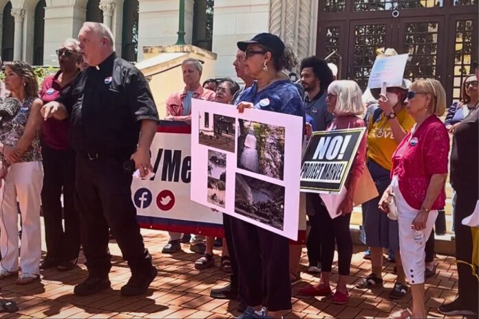 COPS/Metro held a fiery press event outside City Hall in response to the city’s newly released economic impact study on Project Marvel