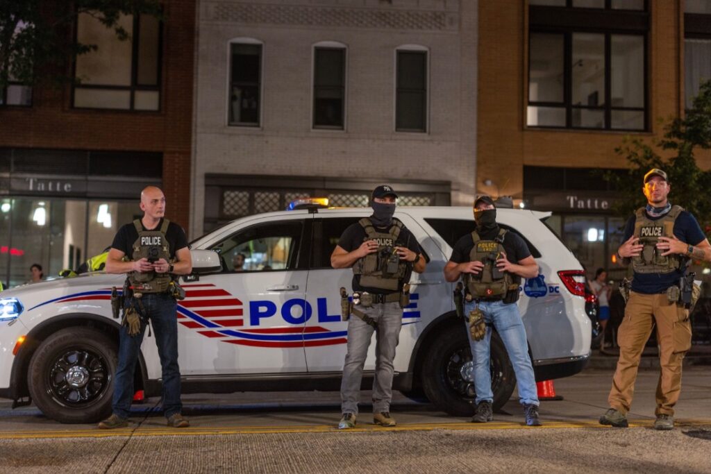 Police officers set up a roadside checkpoint on 14th Street Northwest on Aug. 13, 2025 in Washington, D.C. (Photo by Tasos Katopodis/Getty Images)
