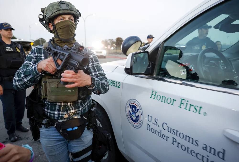 A U.S. Customs and Border Patrol agent outside Coast Guard Island in Oakland, Calif., on Thursday.Justin Sullivan / Getty Images