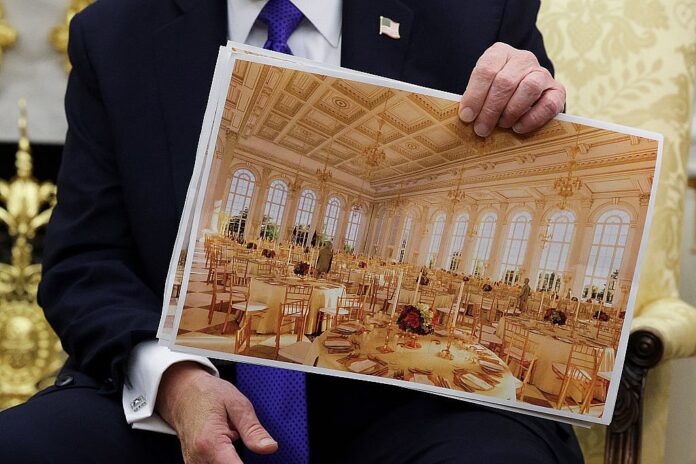 U.S. President Donald Trump displays a rendering of his proposed $250 million White House ballroom as he meets with NATO Secretary General Mark Rutte, October 22, 2025 in Washington, DC. (Photo by Alex Wong/Getty Images)