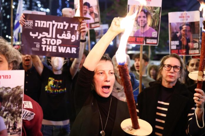Hundreds of supporters of Israeli hostages gathered in Tel Aviv in response to the announcement of a ceasefire. Photograph: Anadolu/Getty Images