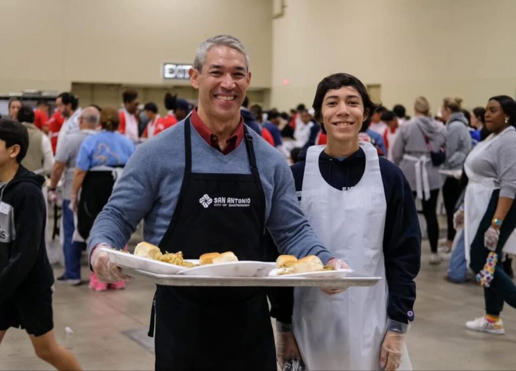 Former Mayor Ron Nirenberg and Son at the Raul Jimenez Thanksgiving Dinner