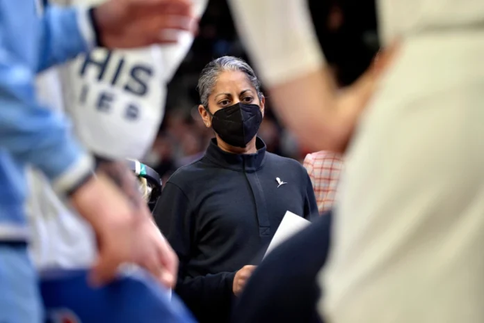 Sonia Raman, then an assistant coach for the Memphis Grizzlies, stands in a team huddle during an NBA game against the Dallas Mavericks on Jan. 14, 2022, in Memphis, Tennessee.