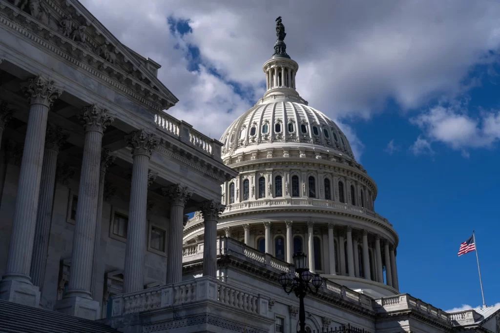 The U.S. Capitol stands amid the ongoing government shutdown as lawmakers remain divided over spending and health care priorities.