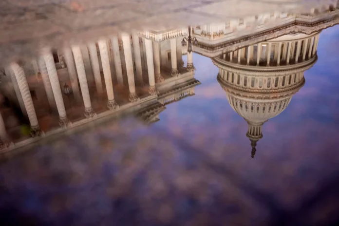 The Dome of the U.S. Capitol Building is visible in reflection on October 14, in Washington, D.C. Andrew Harnik / Getty Images