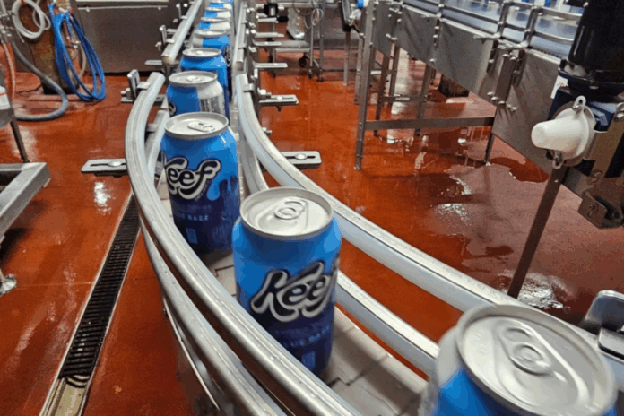 Cans of seltzer containing THC, the active ingredient in marijuana, speed down the canning line at Indeed Brewing in Minneapolis on Thursday, Nov. 20, 2025. (AP Photo/Steve Karnowski)