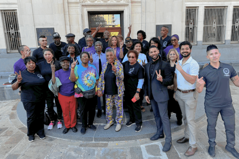 United Homeowners Improvement Association and District 2 Councilman Jalen McKee-Rodriguez pose for a celebratory picture after the winning vote to rezone the neighborhood. The San Antonio Observer