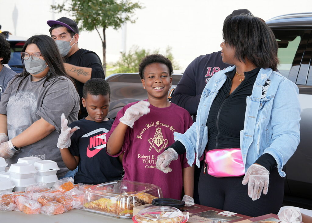 Youth groups participated in the Thanksgiving Community Outreach Program for the Homeless hosted by District Council 19. The program held downtown provided a full-course Thanksgiving meal to more than 150 less fortunate individuals. (Photo by Bro. Burrell Parmer)
