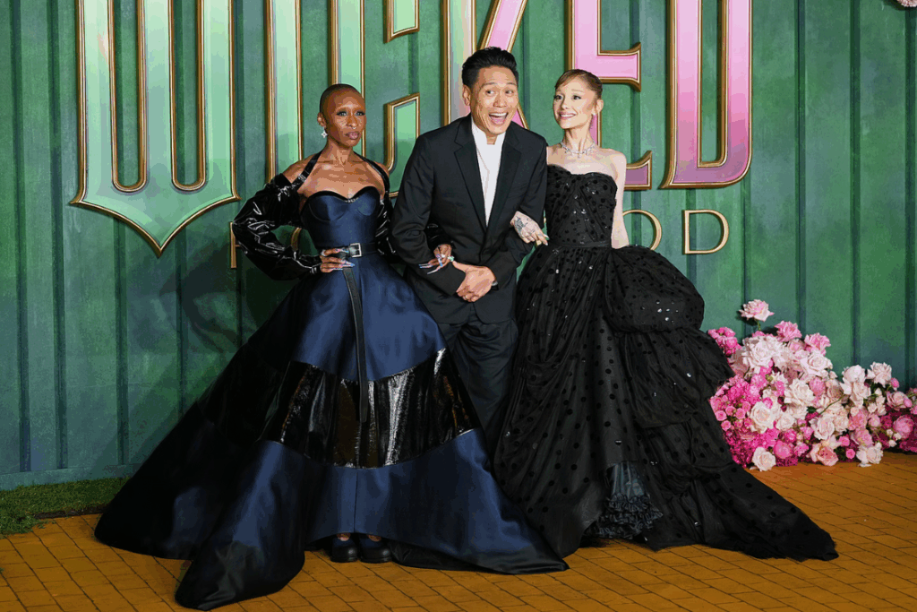 Cynthia Erivo, from left, director Jon M. Chu and Ariana Grande pose for photographers upon arrival at the premiere of the film "Wicked For Good" in London, Monday, Nov. 10, 2025. (Photo by Scott A Garfitt/Invision/AP)