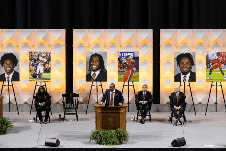 University of Virginia head football coach Tony Elliott speaks at a memorial service for three football players that were fatally shot, in Charlottesville, Va., on Nov. 19, 2022. Mike Kropf / The Daily Progress via AP, file