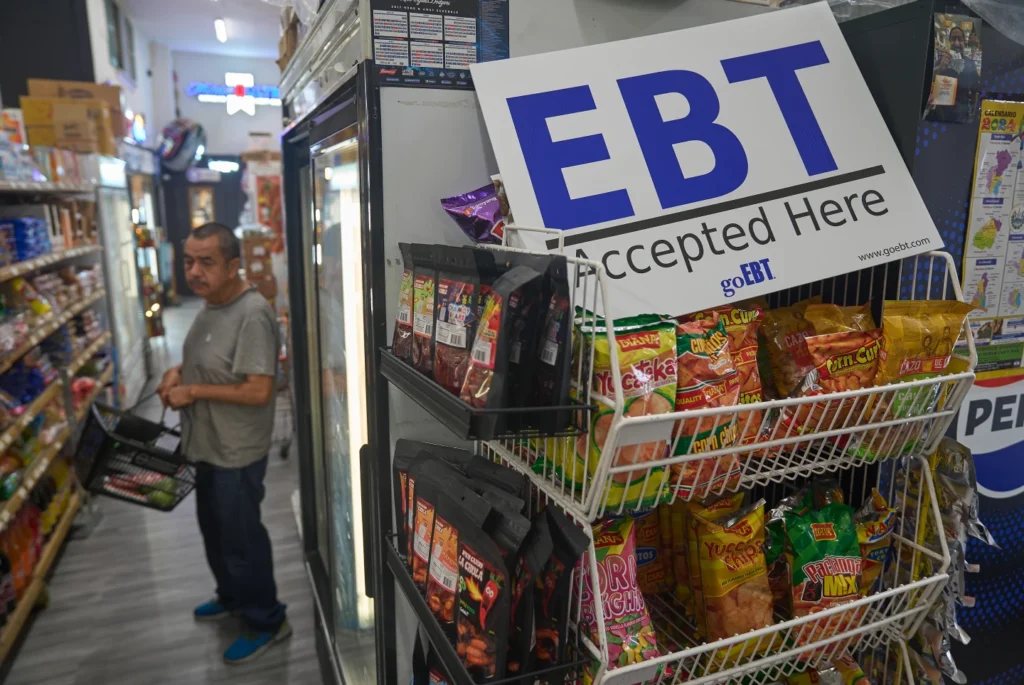  A banner reads: “EBT (Electronic Benefit Transfer) Accepted Here,” at El Recuerdo Market in Los Angeles, Oct. 31, 2025, after two federal judges ordered President Donald Trump’s administration to continue funding SNAP during the government shutdown. (AP Photo/Damian Dovarganes, file)
Volunteers work to package meals during the food pantry service at Calvary Episcopal Church on Oct. 30, 2025, in Louisville, Ky. (AP Photo/Jon Cherry, file)
3 of 6 |  Volunteers work to package meals during the food pantry service at Calvary Episcopal Church on Oct. 30, 2025, in Louisville, Ky. (AP Photo/Jon Cherry, file)
Community members wait in line to enter the food pantry service at Calvary Episcopal Church on Oct. 30, 2025, in Louisville, Ky. (AP Photo/Jon Cherry, file)
4 of 6 |  Community members wait in line to enter the food pantry service at Calvary Episcopal Church on Oct. 30, 2025, in Louisville, Ky. (AP Photo/Jon Cherry, file)
Brock Brooks, a disable Marine Corps veteran, cries while describing the impending SNAP shutdowns while waiting in line to enter the food pantry service at Calvary Episcopal Church on Oct. 30, 2025, in Louisville, Ky. (AP Photo/Jon Cherry, file)
5 of 6 |  Brock Brooks, a disable Marine Corps veteran, cries while describing the impending SNAP shutdowns while waiting in line to enter the food pantry service at Calvary Episcopal Church on Oct. 30, 2025, in Louisville, Ky. (AP Photo/Jon Cherry, file)
A volunteer helps gather bags of food at the Holy Apostles Soup Kitchen and Pantry in the Chelsea neighborhood of Manhattan in New York, on Wednesday, Oct. 29, 2025. (AP Photo/Joseph B. Frederick)
6 of 6 |  A volunteer helps gather bags of food at the Holy Apostles Soup Kitchen and Pantry in the Chelsea neighborhood of Manhattan in New York, on Wednesday, Oct. 29, 2025. (AP Photo/Joseph B. Frederick)