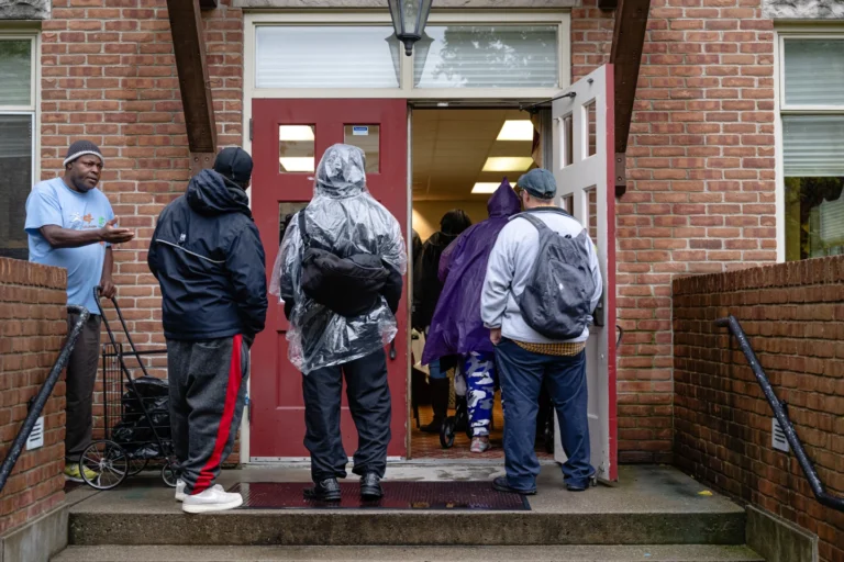 Community members wait in line to enter the food pantry service at Calvary Episcopal Church on Oct. 30, 2025, in Louisville, Ky. (AP Photo/Jon Cherry, file)