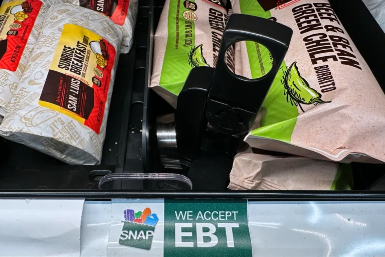 A SNAP EBT sign is displayed on a shelf at a gas station in Riverwoods, IIl., Saturday, Nov. 1, 2025. (AP Photo/Nam Y. Huh)