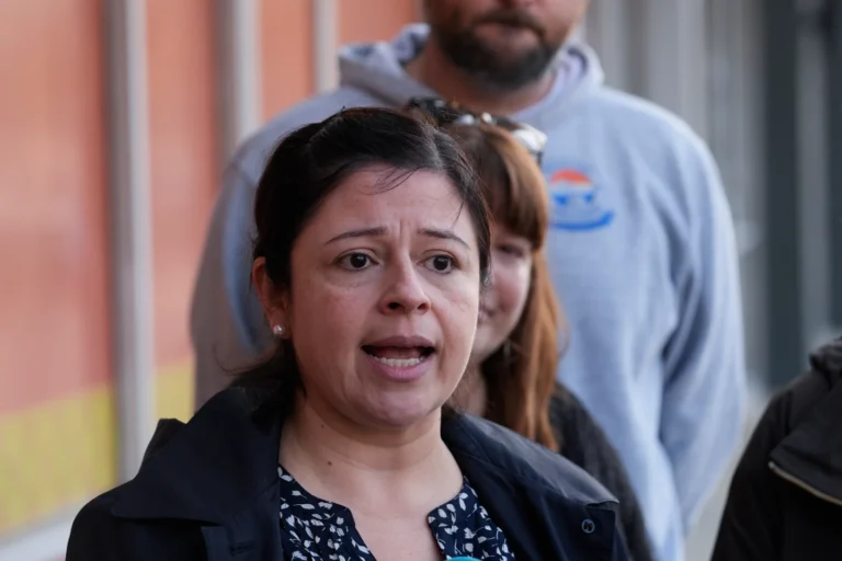 Maria Guzman and other parents of young children speak outside of Rayito de Sol Spanish Immersion Early Learning Center after an employee of the preschool was arrested by federal immigration agents, Wednesday, Nov. 5, 2025, in Chicago. (AP Photo/Erin Hooley)