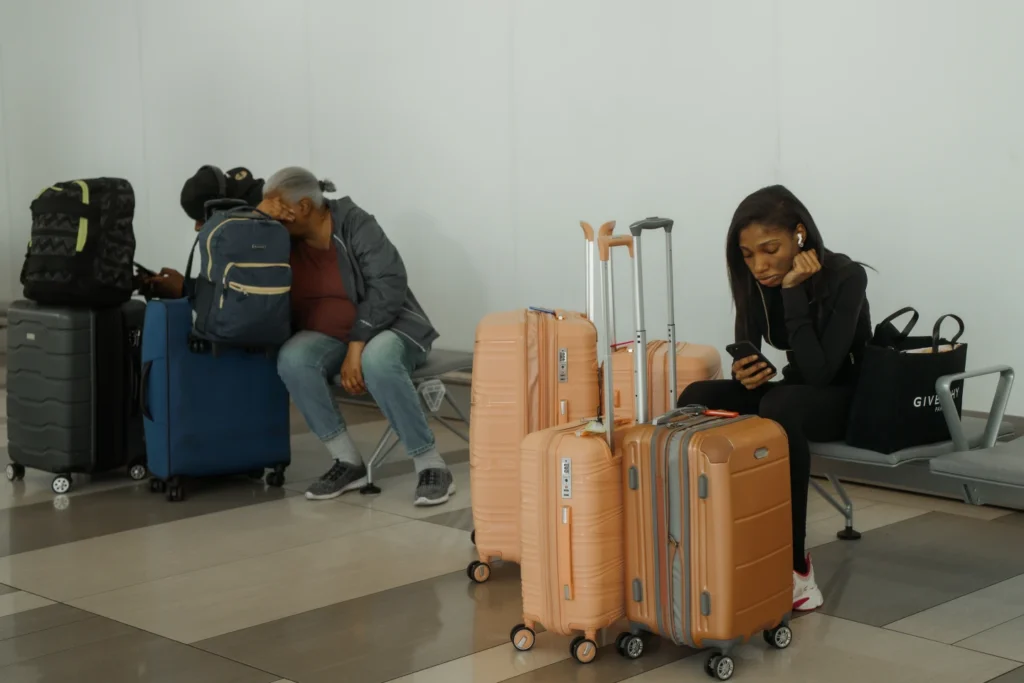 Travelers wait at LaGuardia International Airport in New York, Saturday, Nov. 8, 2025. (AP Photo/Olga Fedorova)