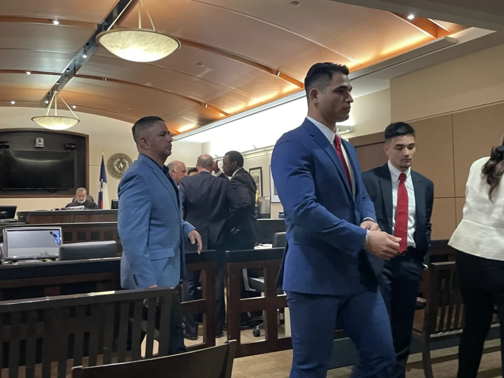 Former SAPD officers Nathaniel Villalobos (right) and Alfred Flores (left) leaving the courtroom on Tuesday. Josh Peck / Texas Public Radio