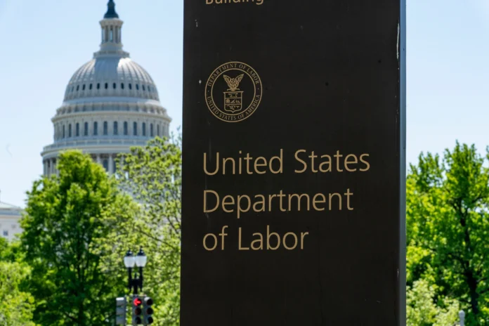 In this May 7, 2020, file photo, the entrance to the Labor Department is seen near the Capitol in Washington. (AP Photo/J. Scott Applewhite, File)