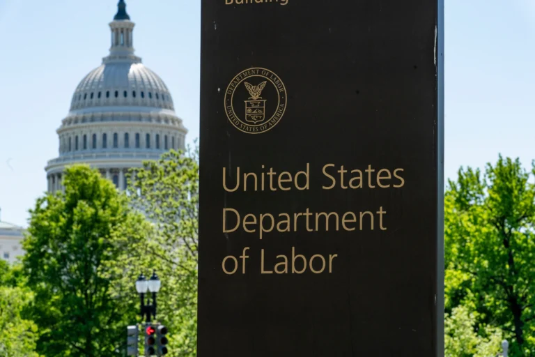 In this May 7, 2020, file photo, the entrance to the Labor Department is seen near the Capitol in Washington. (AP Photo/J. Scott Applewhite, File)