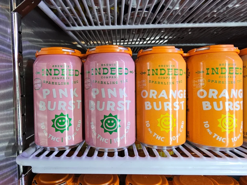 Cans of seltzer containing THC, the active ingredient in marijuana, are shown in a cooler at the Indeed Brewery taproom in Minneapolis on Thursday, Nov. 20, 2025. (AP Photo/Steve Karnowski)