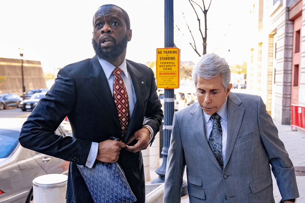 Prakazrel "Pras" Michel, a member of the 1990s hip-hop group the Fugees, accompanied by defense lawyer David Kenner, right, arrives at federal court April 3, 2023, in Washington. (AP Photo/Andrew Harnik, File)