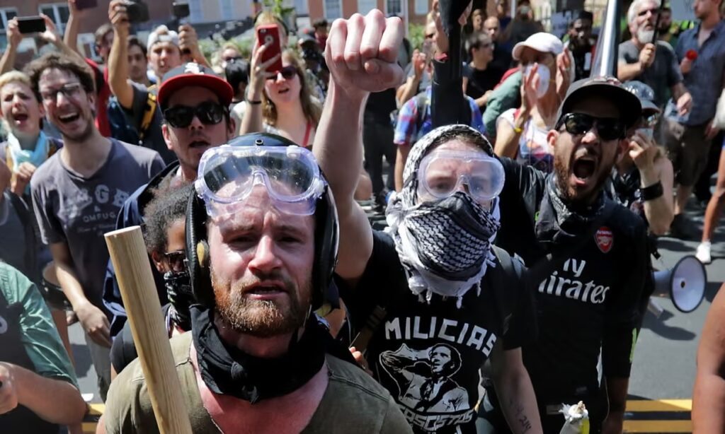 Anti-fascist counter-protesters seen outside Lee Park in Charlottesville, Virginia on 12 August. White nationalists and neo-Nazis were forced to leave the park when their Unite the Right rally was declared an unlawful gathering. Photograph: Chip Somodevilla/Getty Images