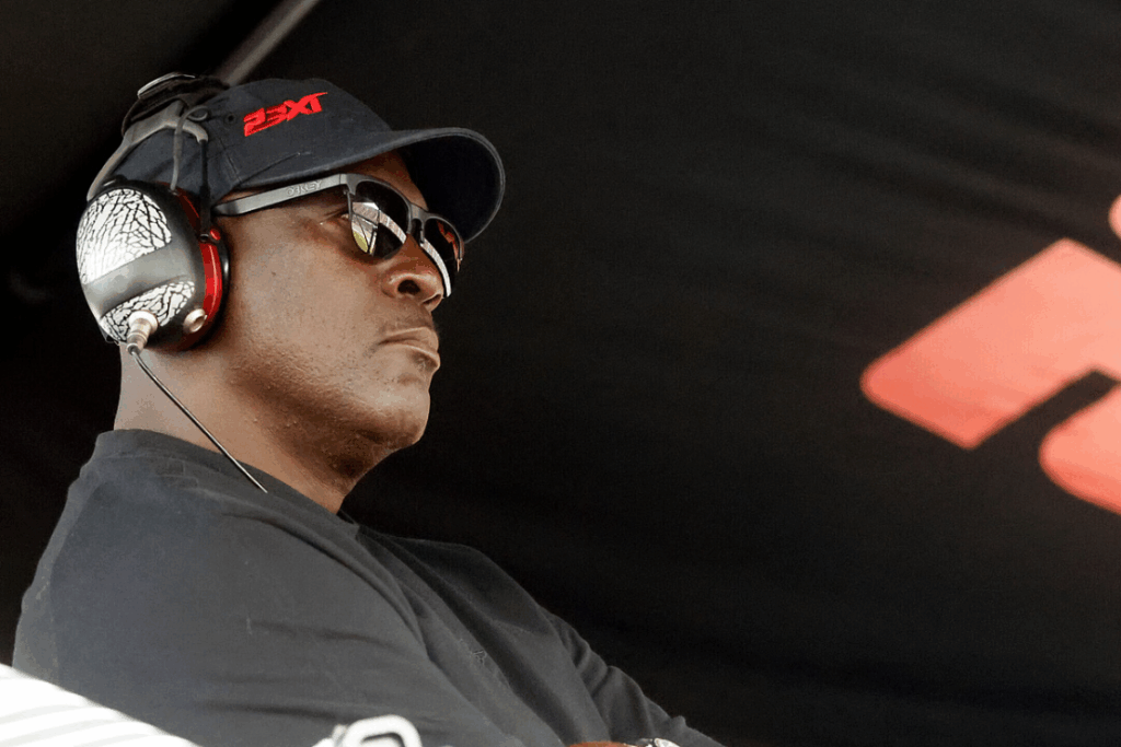 Michael Jordan, co-owner of 23XI Racing, sits in his pit box during a NASCAR Cup Series auto race at Talladega Superspeedway, Sunday, Oct. 6, 2024, in Talladega, Ala. (AP Photo/ Butch Dill, File)