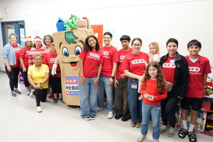 H-E-B volunteers assisted children with selection of toys during the 47th Annual Claude W. Black Community Center Holiday Gift Giveaway hosted by the Claude W. Black Center Advisory Board in partnership with the Dreambuilders of Texas Charitable Foundation. The giveaway was presented by H-E-B and supported by numerous sponsors. (Photo by Burrell Parmer/CWB)