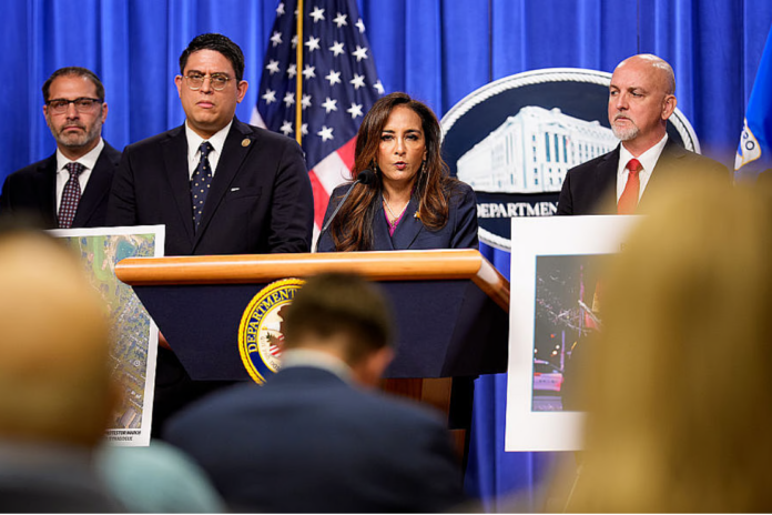 Assistant Attorney General for Civil Rights Harmeet Dhillon, accompanied by her aides, speaks during a news conference at the Justice Department on September 29, 2025 in Washington, DC. (Photo by Andrew Harnik/Getty Images)