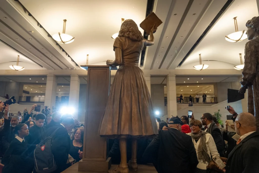 People take photos of a statue of Virginia civil rights activist Barbara Rose Johns, whose statue will replace one of Robert E. Lee as one of Virginia’s two statues on display at the Capitol, at a dedication ceremony Tuesday, Dec. 16, 2025, in Washington. (AP Photo/Mark Schiefelbein)