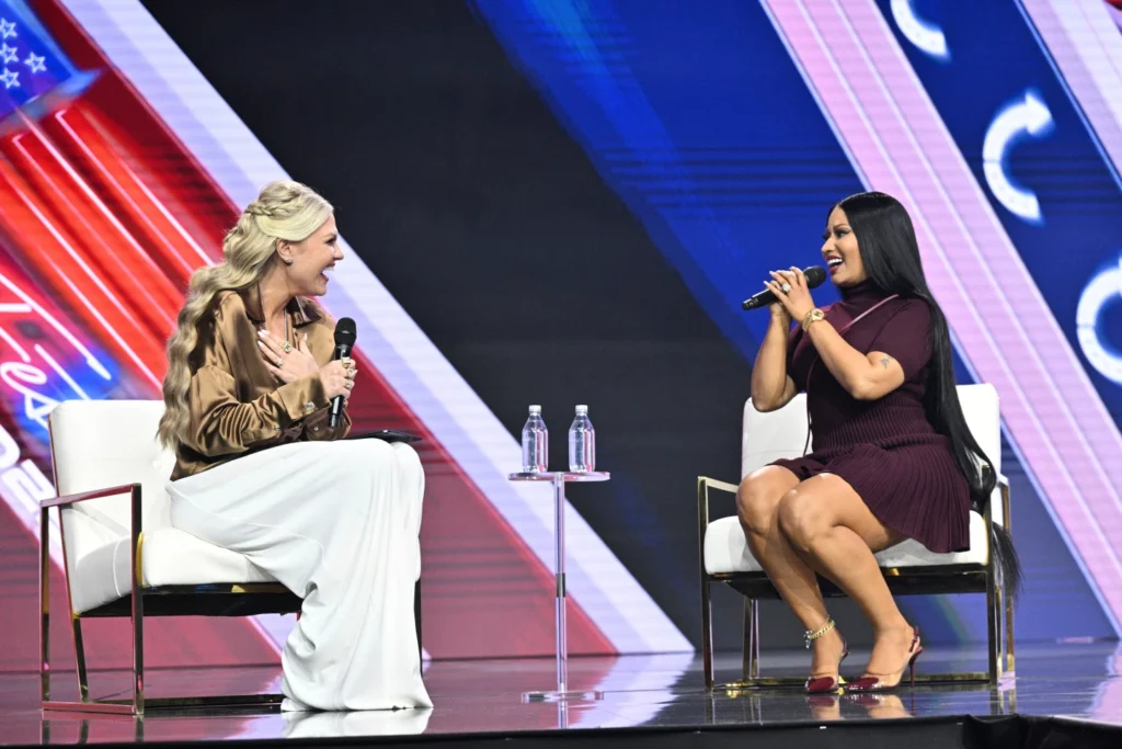 Erika Kirk, left, and Nicki Minaj speak during Turning Point USA's AmericaFest 2025, Sunday, Dec. 21, 2025, in Phoenix.
(AP Photo/Jon Cherry)