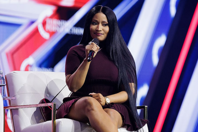 Nicki Minaj is interviewed by Erika Kirk on the final day of Turning Point USA's annual AmericaFest conference at the Phoenix Convention Center on December 21, 2025 in Phoenix, Arizona. Minaj spoke about her frustrations with California Governor Gavin Newsom, and about why she has embraced the conservative movement. (Photo by Caylo Seals/Getty Images