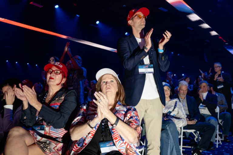 Attendees applaud during Turning Point USA’s AmericaFest 2025, Saturday, Dec. 20, 2025, in Phoenix. (AP Photo/Jon Cherry)