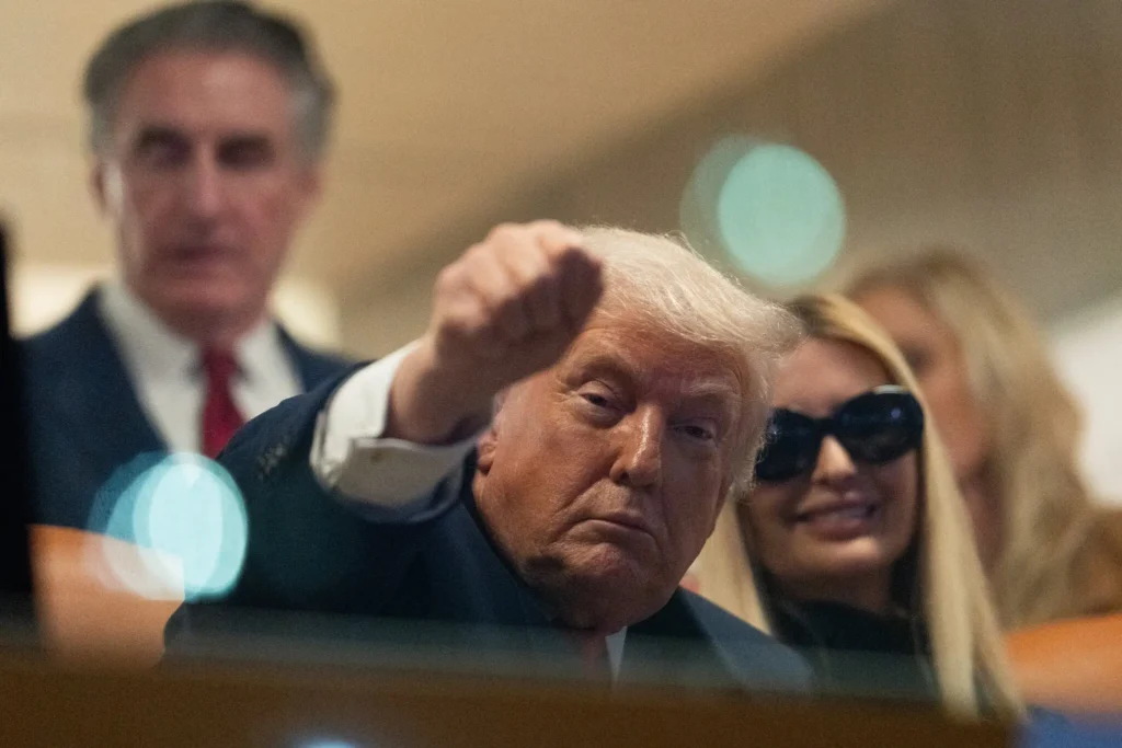 President Donald Trump watches first half of the College Football Playoff national championship game between Miami and Indiana, Monday, Jan. 19, 2026, in Miami Gardens, Fla. Julia Demaree Nikhinson AP
