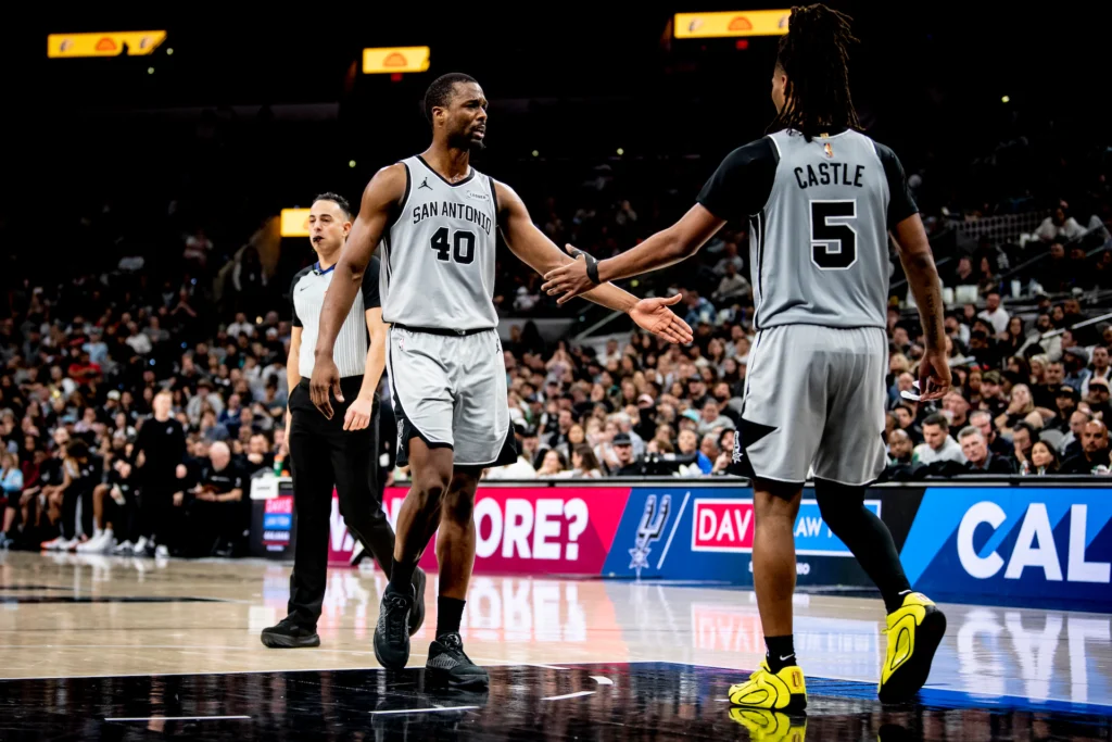 January 3, 2026, San Antonio, TX:<br>San Antonio Spurs forward Harrison Barnes high fives San Antonio Spurs guard Stephon Castle during the fourth quarter against the Portland Trailblazers at the Frost Bank Center in San Antonio, Texas Saturday, January 3, 2026. <br>(Photo by Reginald Thomas II/San Antonio Spurs)