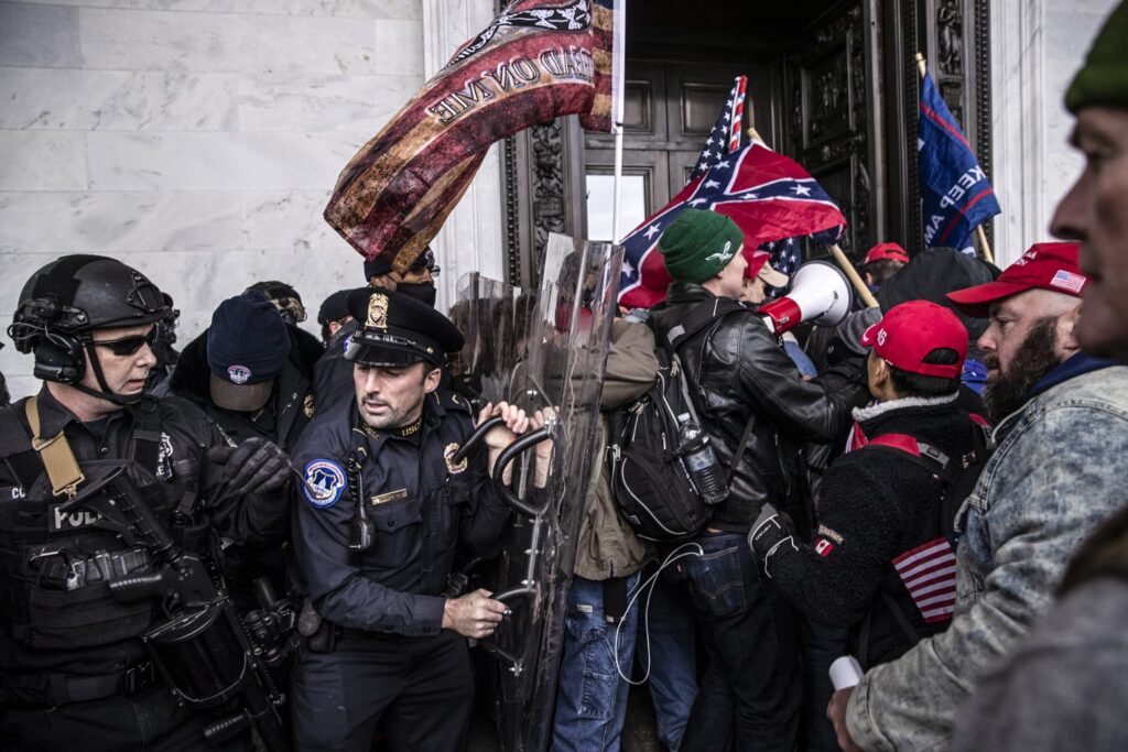 Demonstrators clash with U.S. Capitol police officers while trying to enter the Capitol building during a protest on Jan. 6, 2021.Victor J. Blue / Bloomberg via Getty Images file
