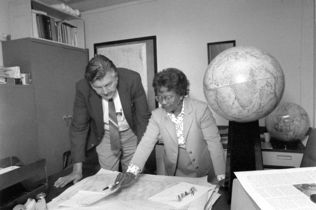 Gladys West and Sam Smith look over data from the Global Positioning System. U.S. Navy