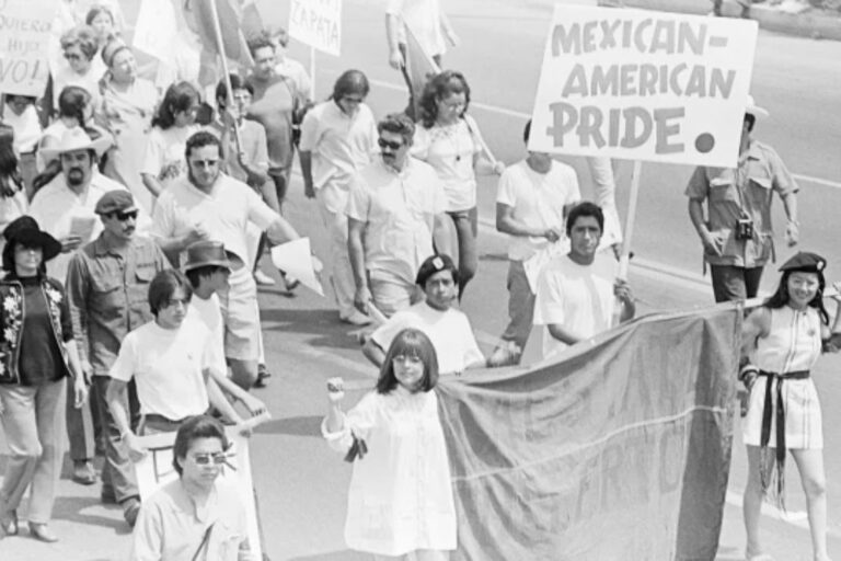Protesters march on Whittier Boulevard during the National Chicano Moratorium. 1970. Copyright Joe Razo and Raúl Ruiz. From the La Raza Photograph Collection. Courtesy of the UCLA Chicano Studies Research Center