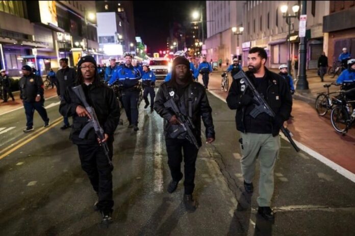 Members of the Black Panther Party for Self-Defense march down Market Street in Philadelphia to rally against the killing of Renee Good.