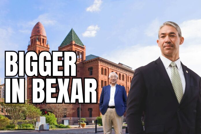 Former San Antonio Mayor Ron Nirenberg stands in the foreground, with Bexar County Judge Peter Sakai pictured behind him in front of the historic Bexar County Courthouse in downtown San Antonio.