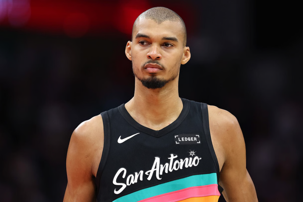 Victor Wembanyama #1 of the San Antonio Spurs looks on during the game against the Houston Rockets at Toyota Center on January 20, 2026 in Houston, Texas. NOTE TO USER: User expressly acknowledges and agrees that, by downloading and or using this photograph, User is consenting to the terms and conditions of the Getty Images License Agreement. (Photo by Kenneth Richmond/Getty Images)